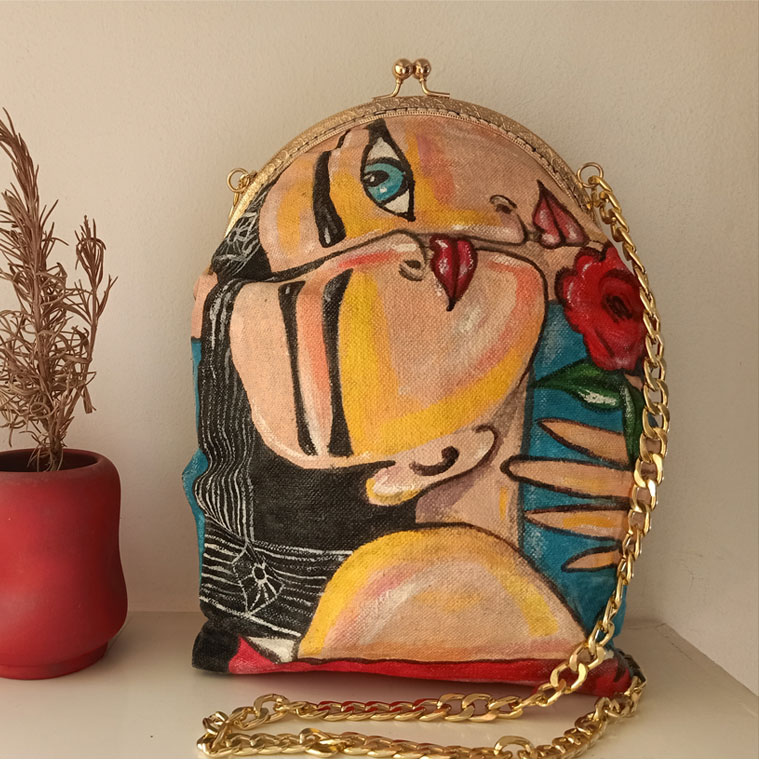 Hand-painted evening bag by Nagwan Magdy