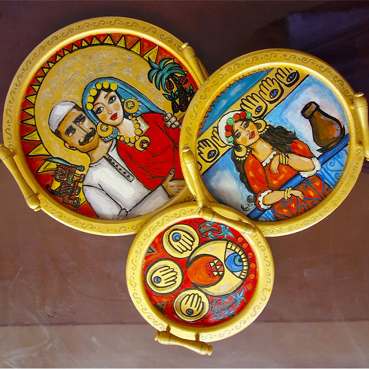 Set of hand-painted serving trays by Nagwan Magdy